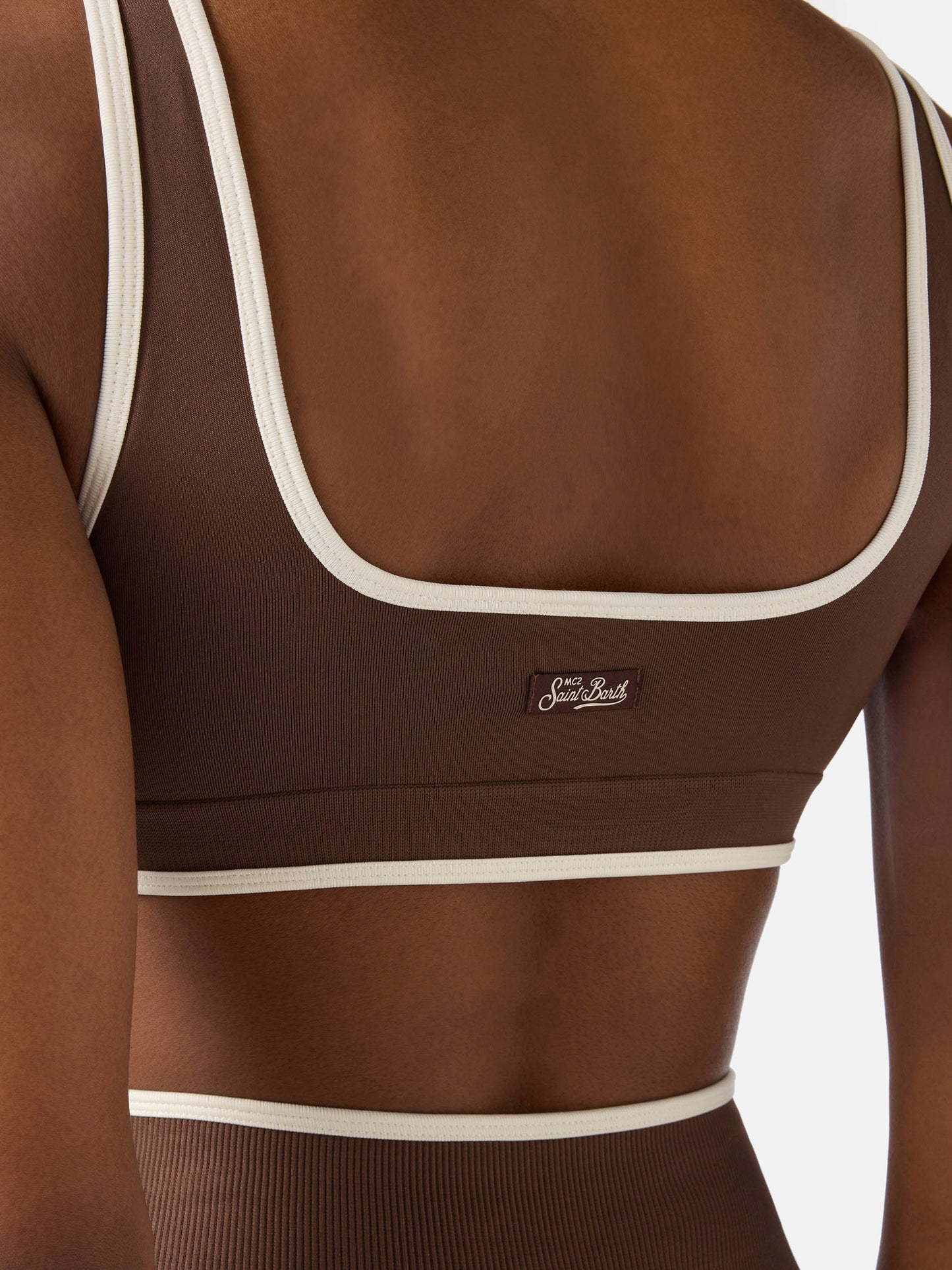 Top sportivo Fify marrone in tessuto tecnico con profili a contrasto