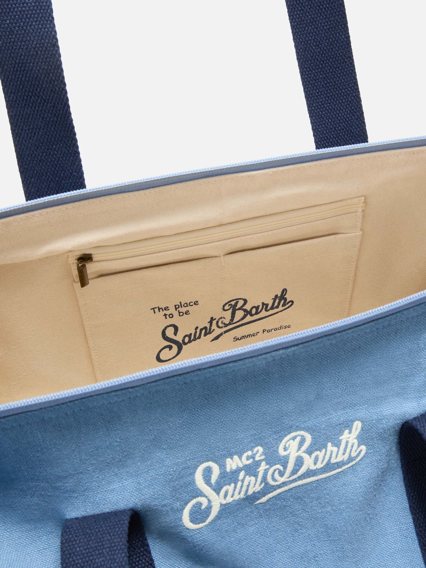 Round Jetleg blue linen weekender with contrasting embroidered logo