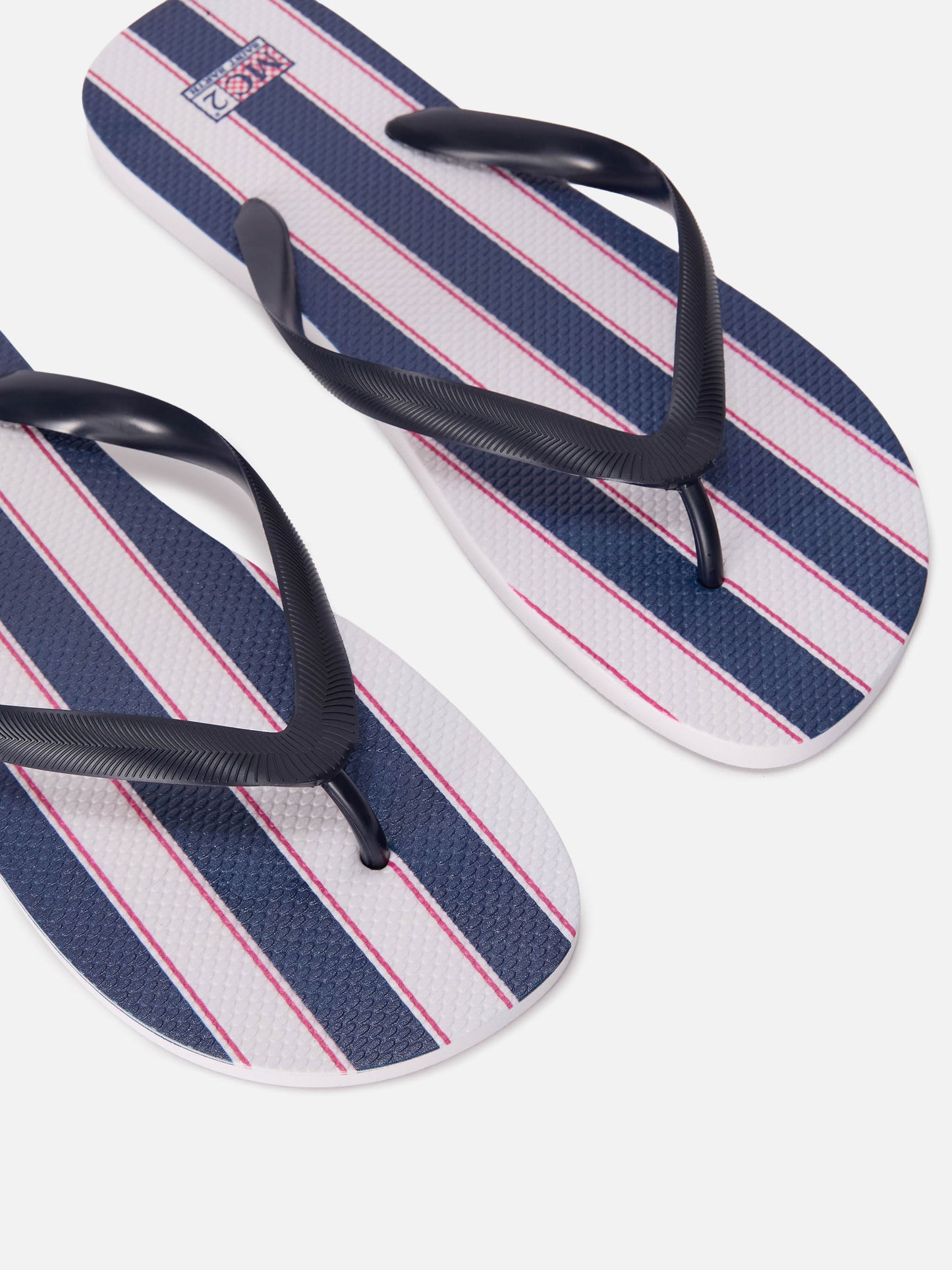 Tommy rubber slip-on flip flops with blue and white wide stripes