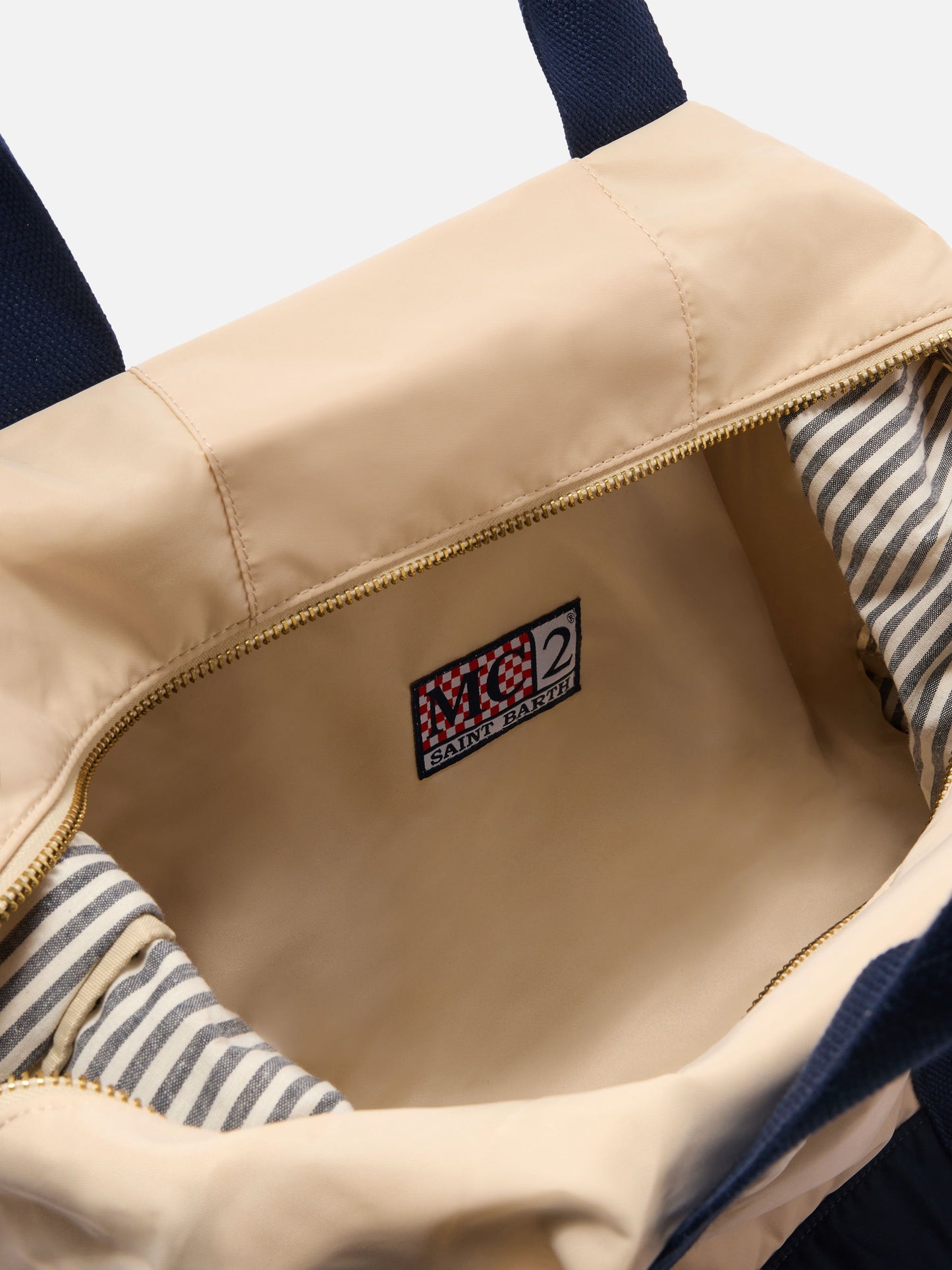 Bolsa de viaje weekender de nylon color crema y azul con logo bordado