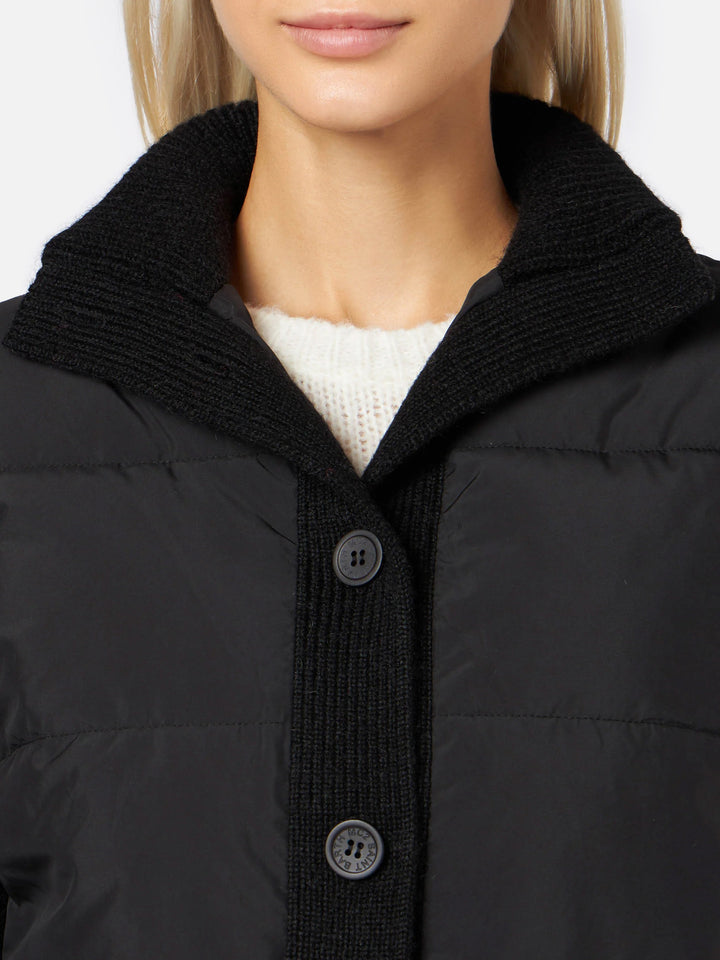 Woman  padded jacket with knitted sleeves