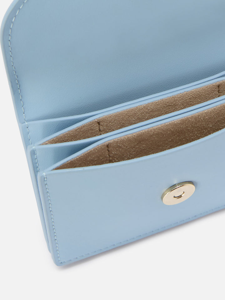 Light blue smooth leather card holder with metal logo
