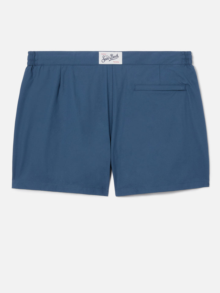 Capferrat swim shorts in solid navy blue with embroidered logo