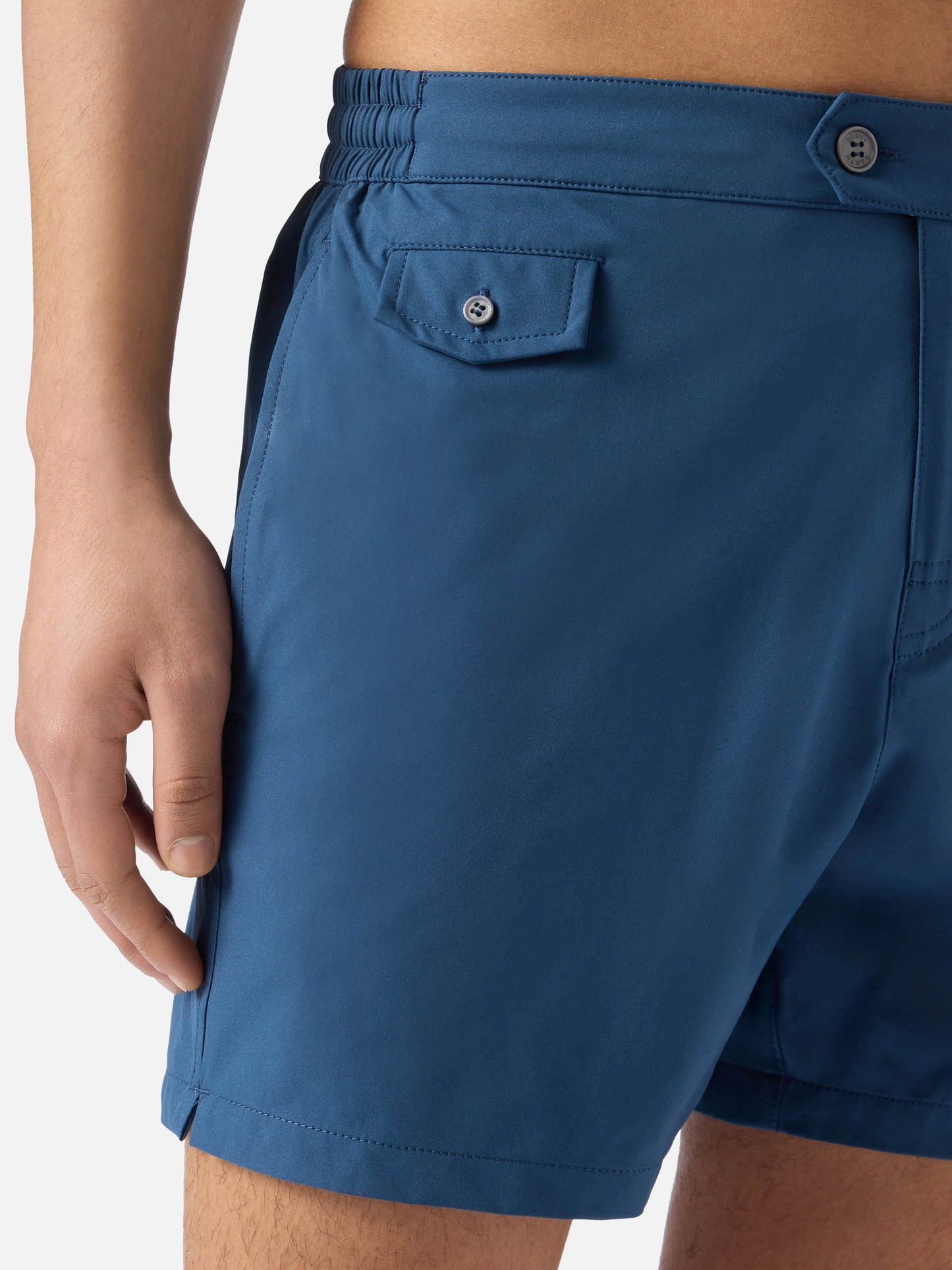 Capferrat swim shorts in solid navy blue with embroidered logo