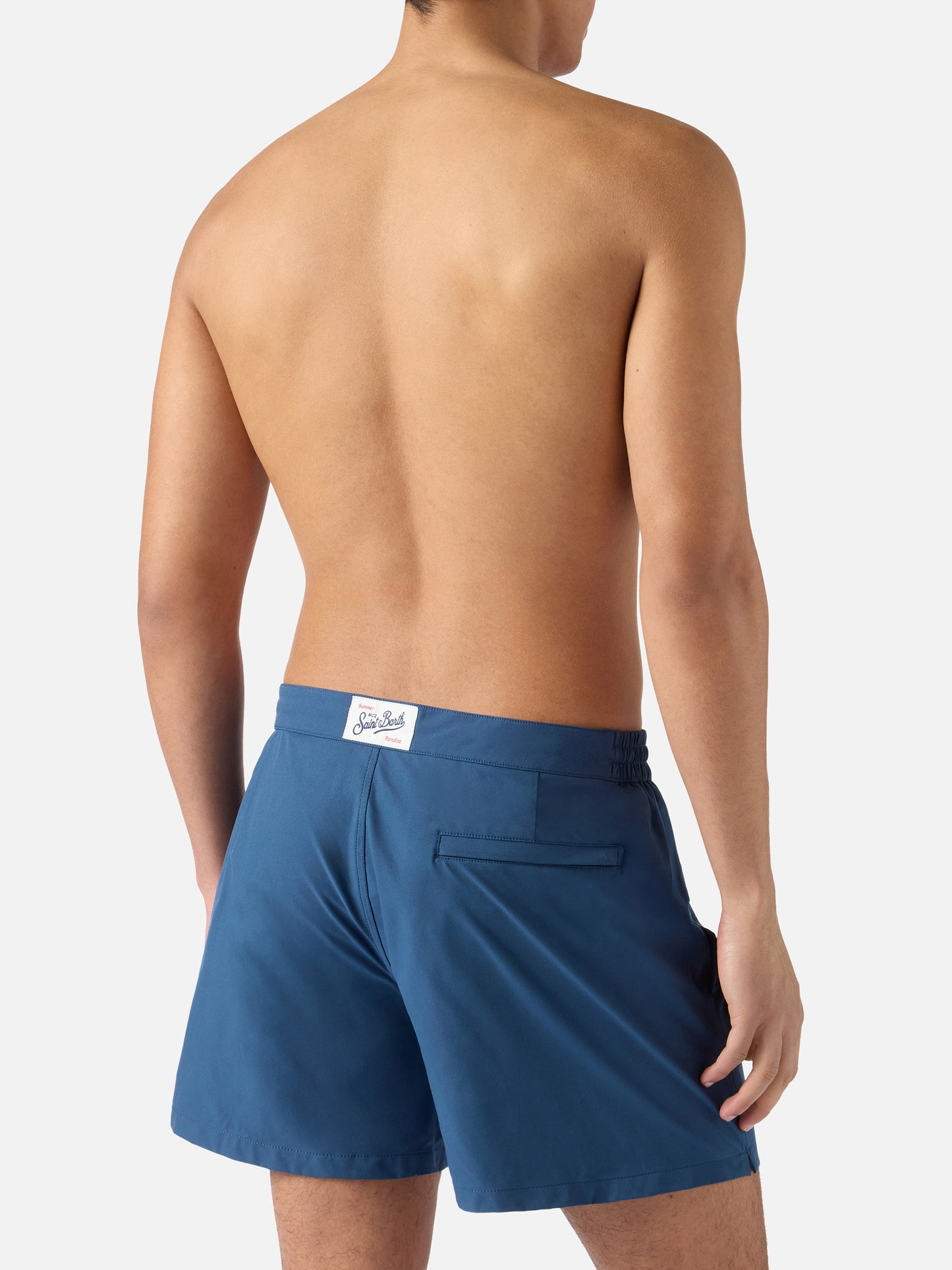 Capferrat swim shorts in solid navy blue with embroidered logo