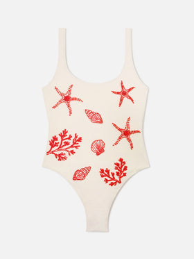 Lora one-piece swimsuit in cream with beaded sea-themed decorations