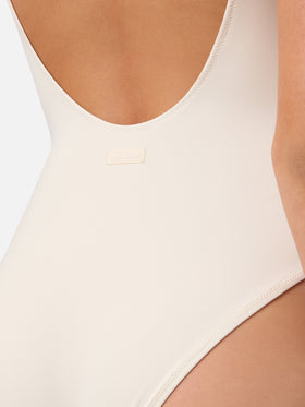 Lora one-piece swimsuit in cream with beaded sea-themed decorations