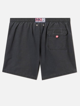 Patmos swim shorts in black with used effect and logo embroidery