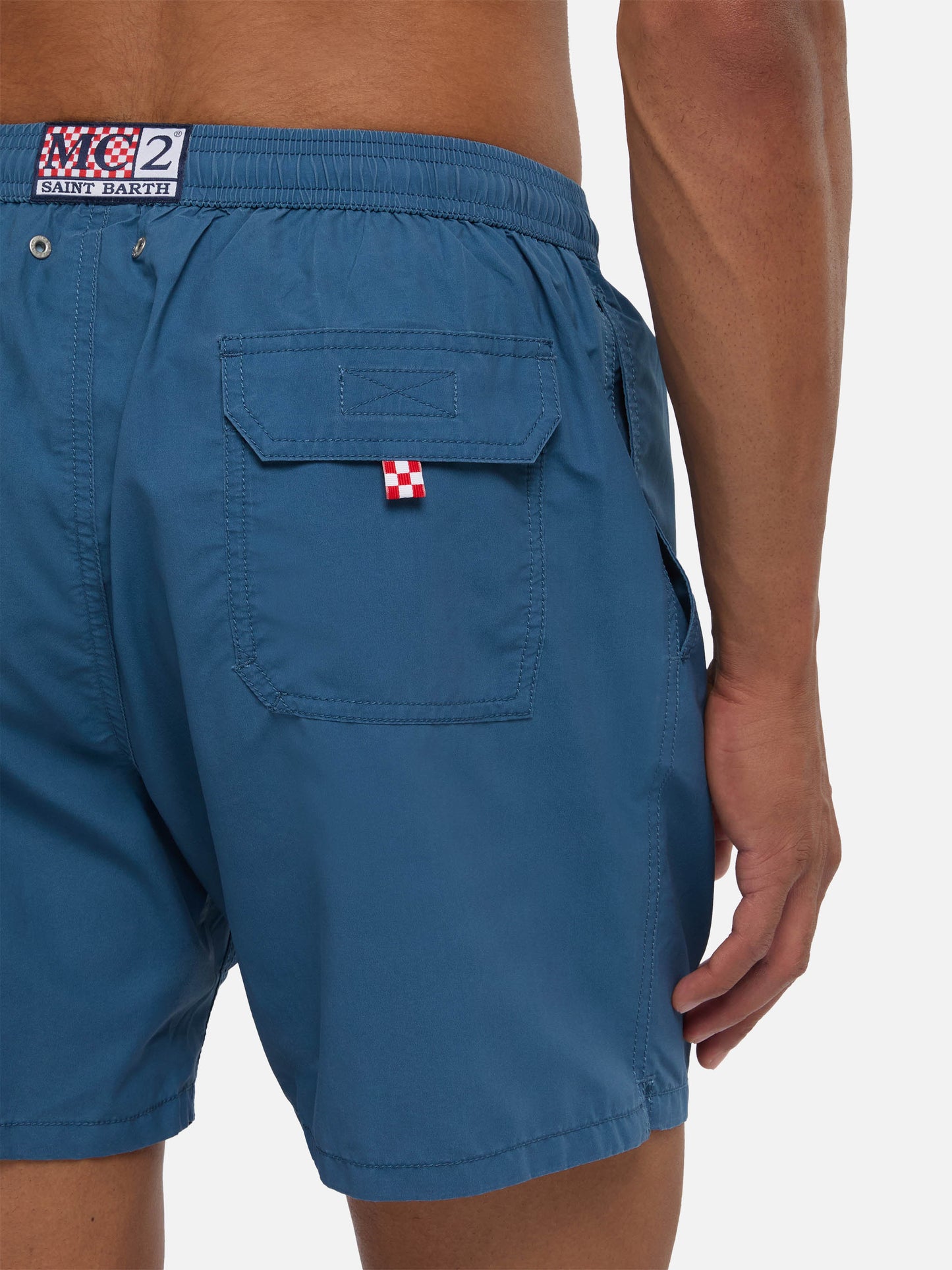 Patmos swim shorts in navy blue with used effect and logo embroidery
